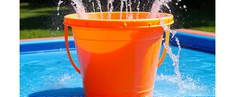 Large dumping bucket emptying water on splash pad